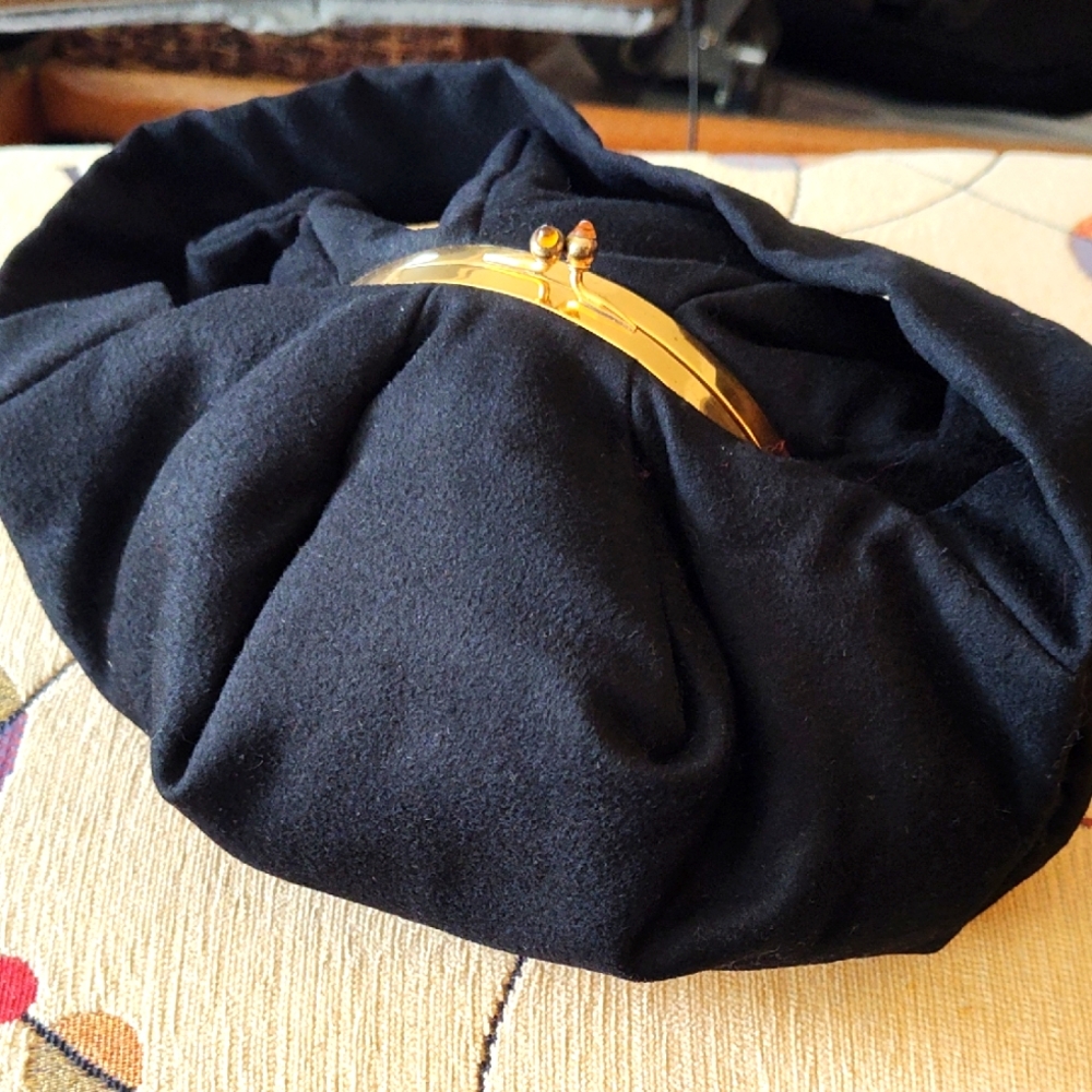 Chic Black Wool Poof Clutch with Gold Accents